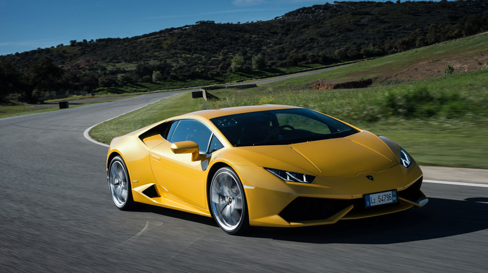 2015-lamborghini-huracan-lp-610-4-yellow-front-three-quarter-in-motion-02.jpg